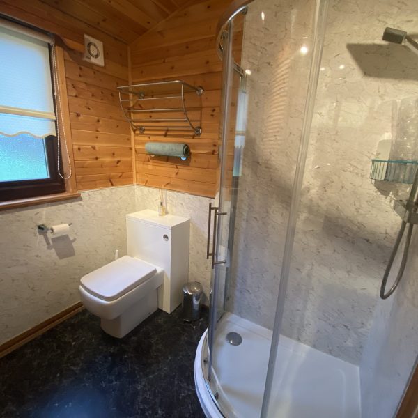 Gust bathroom with corner shower. Loch Lomond Holiday Lodge