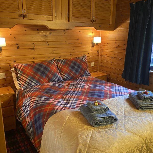Master bedroom with our winter duvet giving a splash of tartan warmth! Loch Lomond Holiday Lodge